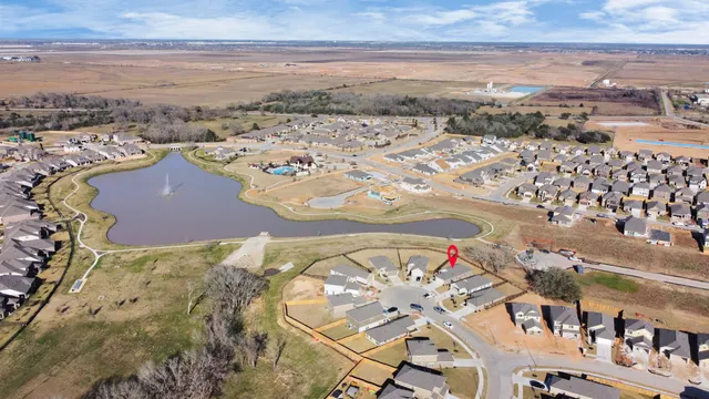 an aerial view of residential houses with outdoor space