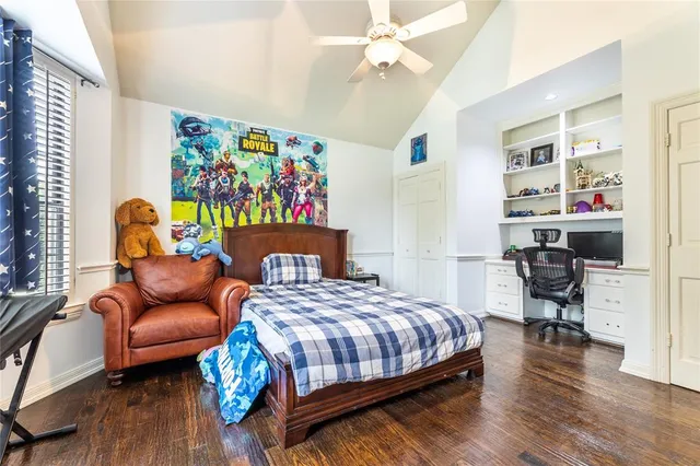 a bedroom with a bed and a workspace