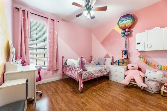 a bedroom with bed and a window