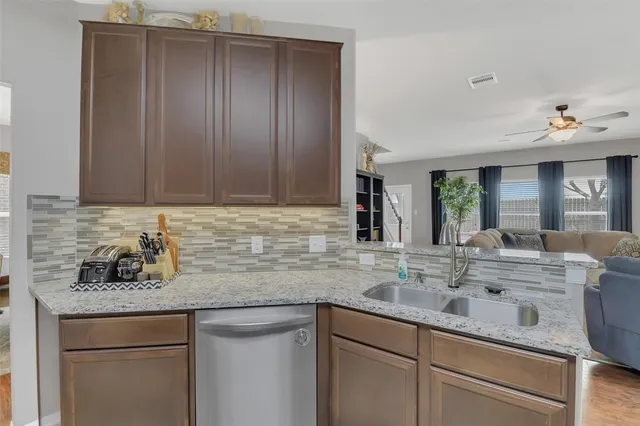 a kitchen with sink cabinets and window