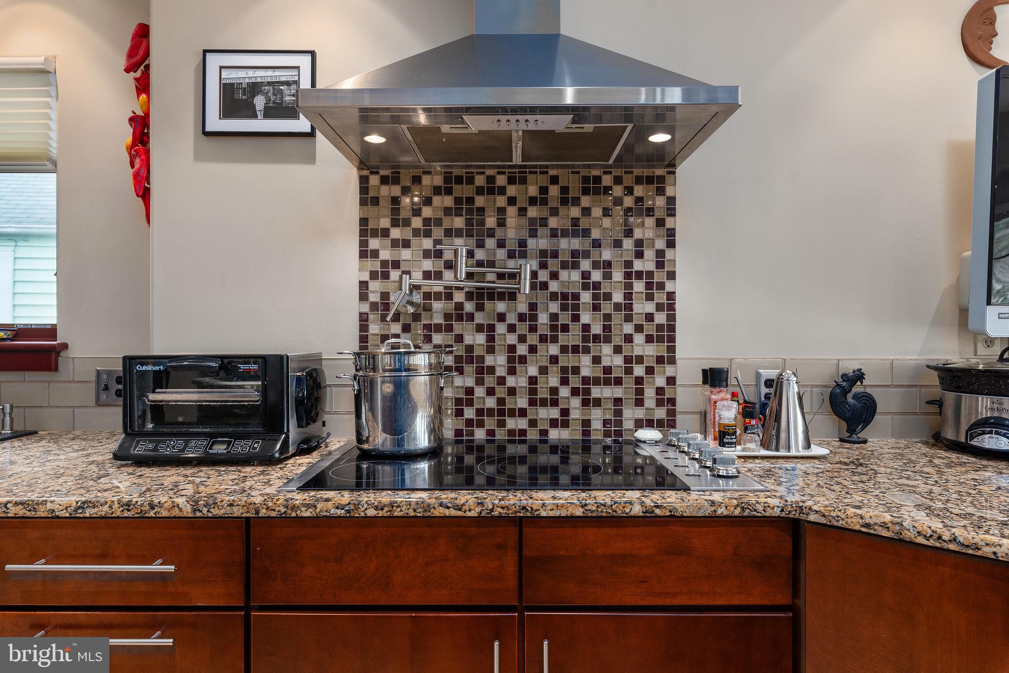 1244 Hillside Road Pasadena, MD 21122 - Photo 22 of 48 Induction cooktop with stainless hood
