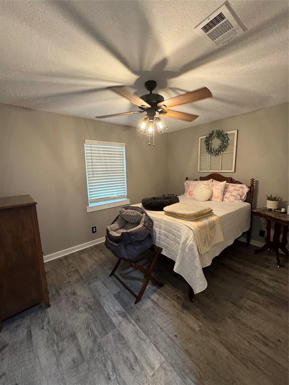 1525 Smith Road Howe, TX 75459 - Photo 13 of 24 a bedroom with a bed dresser and a window