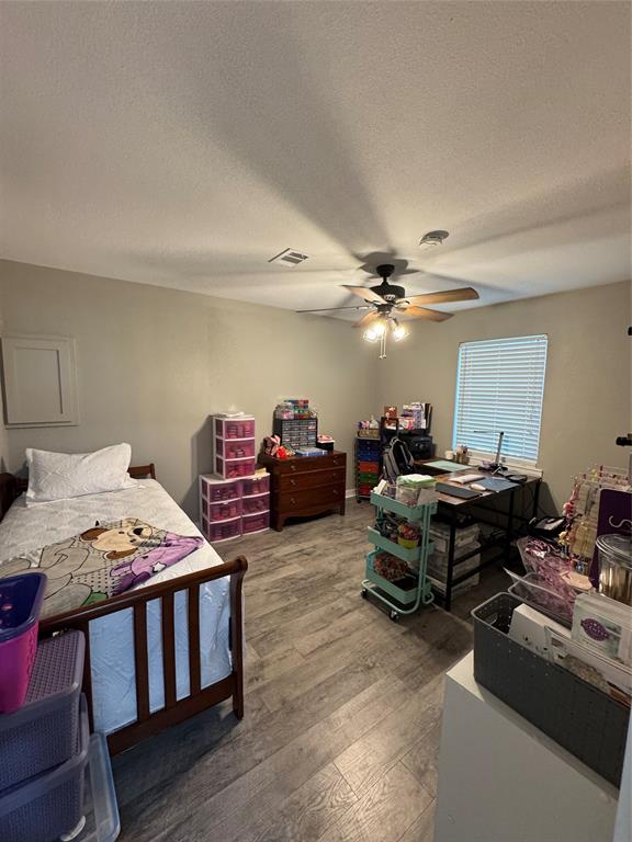 1525 Smith Road Howe, TX 75459 - Photo 14 of 24 a bedroom with furniture and a chandelier