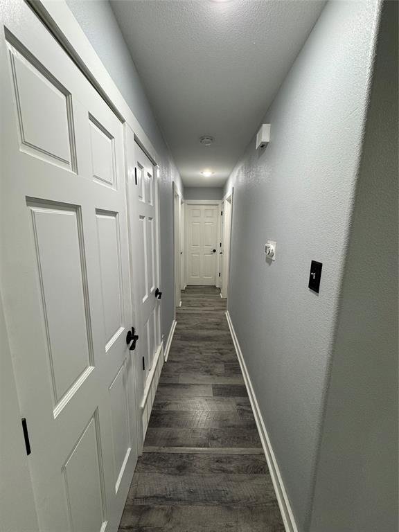 1525 Smith Road Howe, TX 75459 - Photo 16 of 24 a view of a hallway with wooden floor and staircase