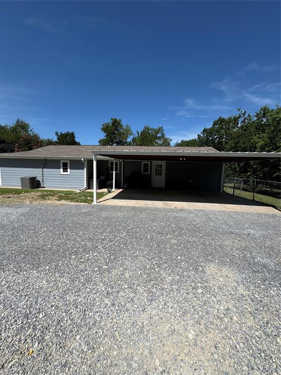 1525 Smith Road Howe, TX 75459 - Photo 17 of 24 a front view of a house with a garden and lake view