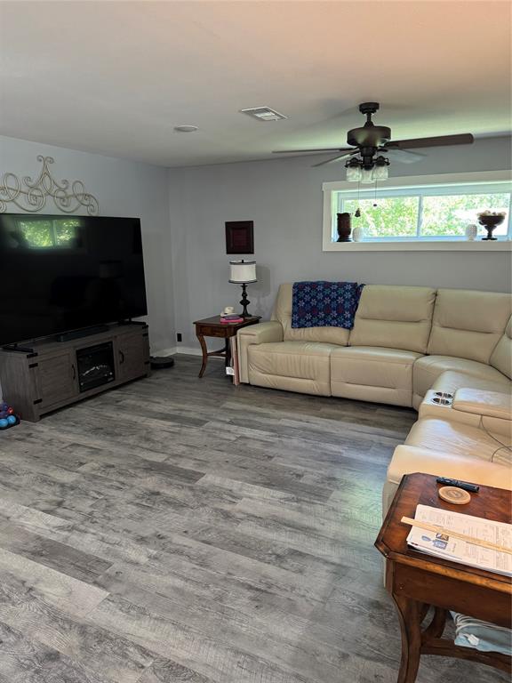 1525 Smith Road Howe, TX 75459 - Photo 2 of 24 a living room with furniture and a flat screen tv