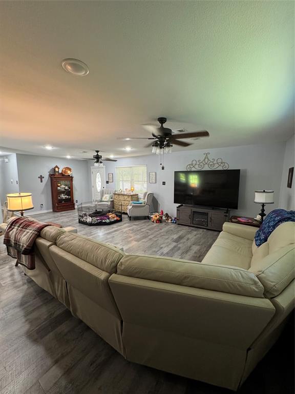1525 Smith Road Howe, TX 75459 - Photo 4 of 24 a living room with furniture and a flat screen tv