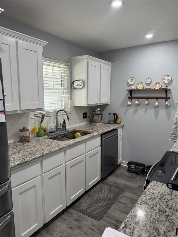 1525 Smith Road Howe, TX 75459 - Photo 6 of 24 a kitchen with a sink and cabinets
