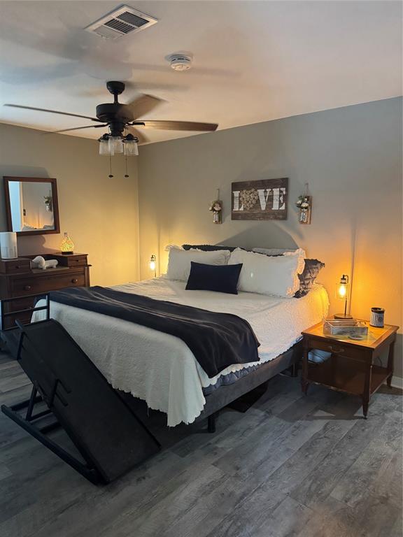 1525 Smith Road Howe, TX 75459 - Photo 10 of 24 a bedroom with a bed and a chandelier