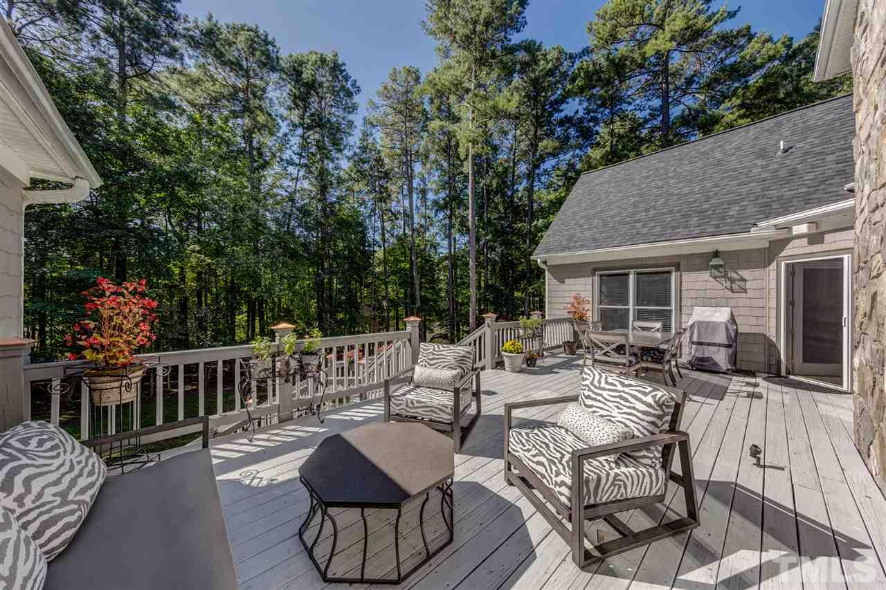 648 Pendleton Lake Road Raleigh, NC 27614 - Photo 22 of 30 a view of a patio with couches table and chairs and potted plants