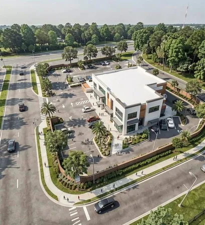 an aerial view of a house with a yard