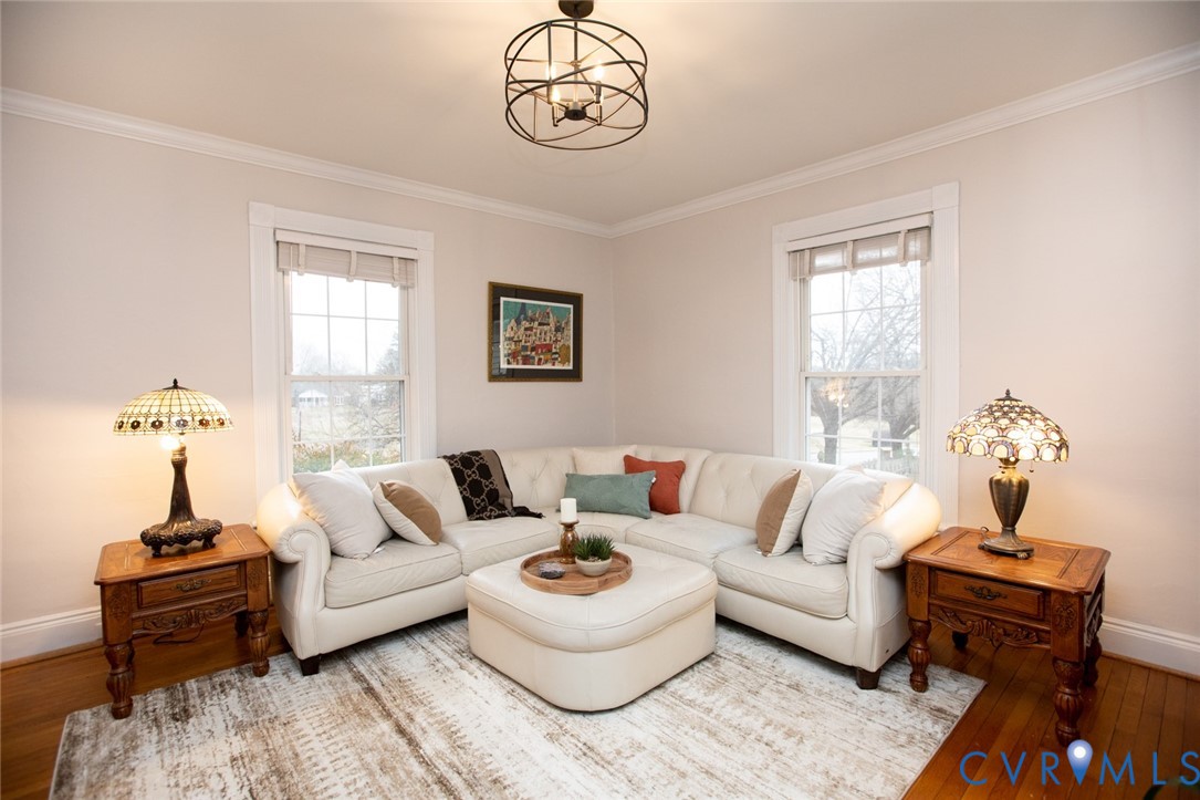 401 2nd Avenue Farmville, VA 23901 - Photo 16 of 55 a living room with furniture and a chandelier