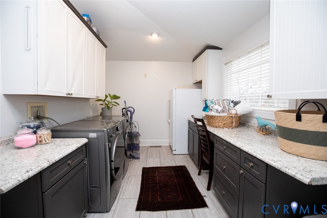 401 2nd Avenue Farmville, VA 23901 - Photo 35 of 55 a kitchen with granite countertop a sink stove and cabinets