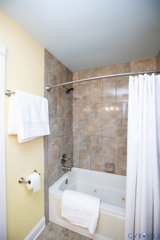 401 2nd Avenue Farmville, VA 23901 - Photo 41 of 55 a bath tub sitting next to a white sink and vanity