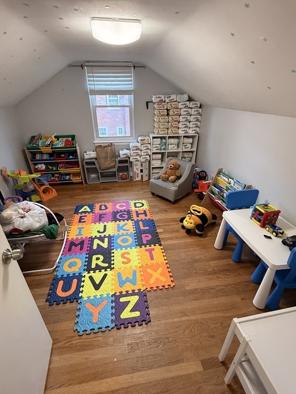 68 Sutcliffe Road Lynn, MA 01904 - Photo 17 of 23 a play room with toys and a couch