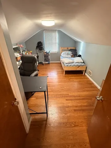 a view of entryway with wooden floor
