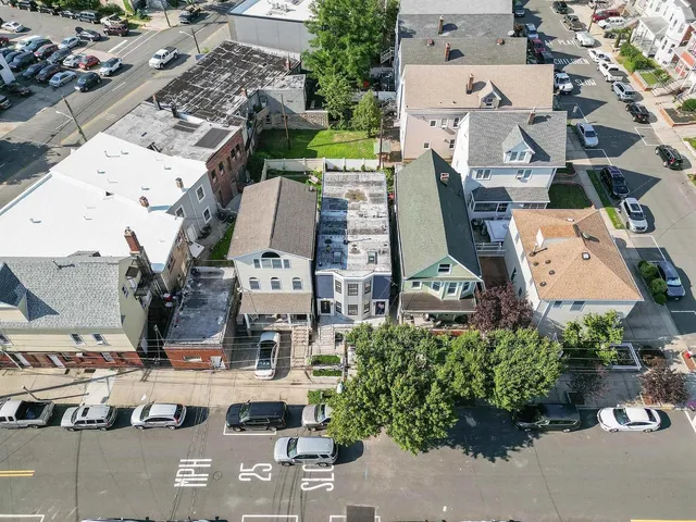 an aerial view of residential houses with outdoor space
