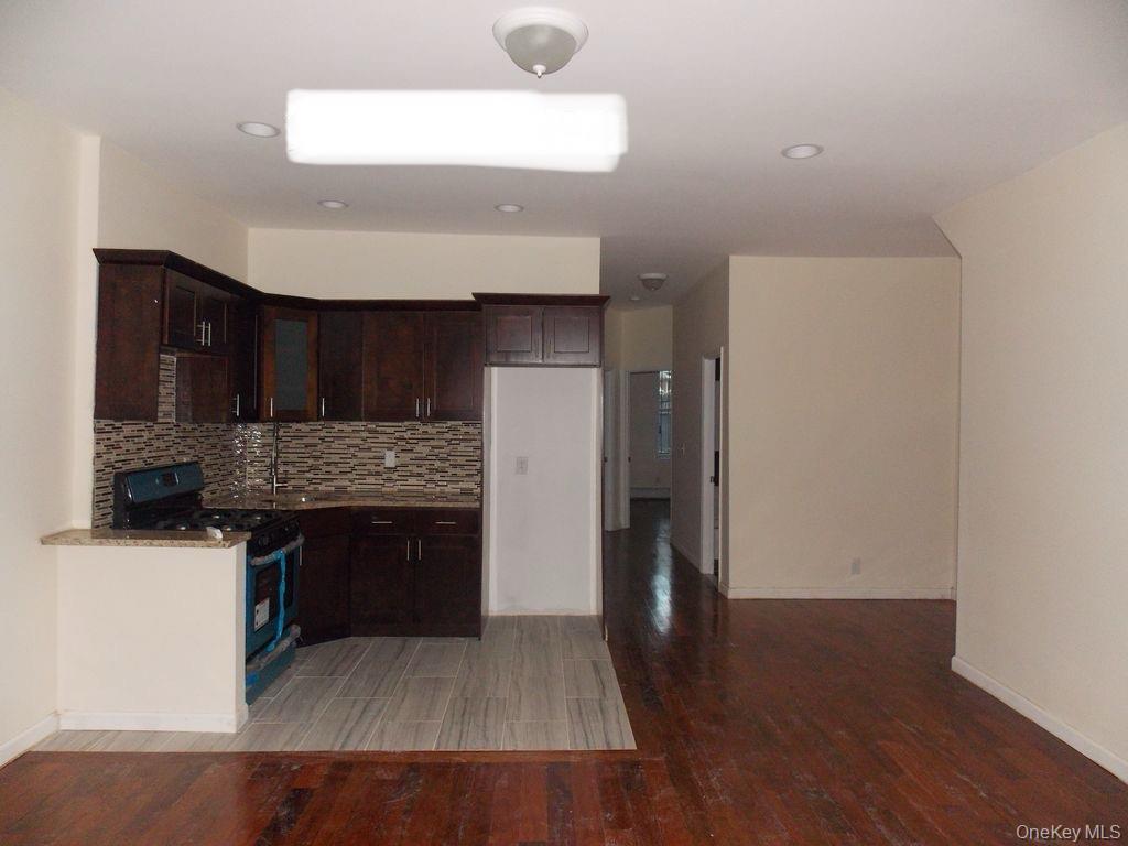439 Forbell Street Brooklyn, NY 11208 - Photo 2 of 8 a kitchen with stainless steel appliances granite countertop a stove and a refrigerator