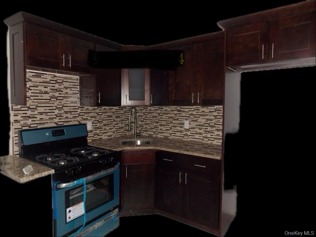 439 Forbell Street Brooklyn, NY 11208 - Photo 3 of 8 a stove top oven sitting inside of a kitchen