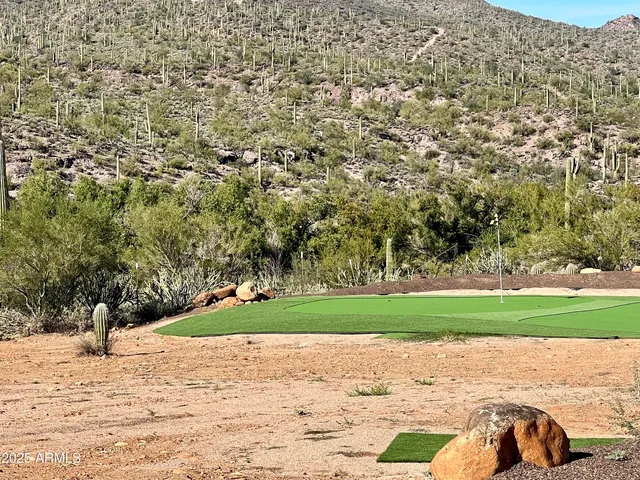 a view of a chairs and table in the patio