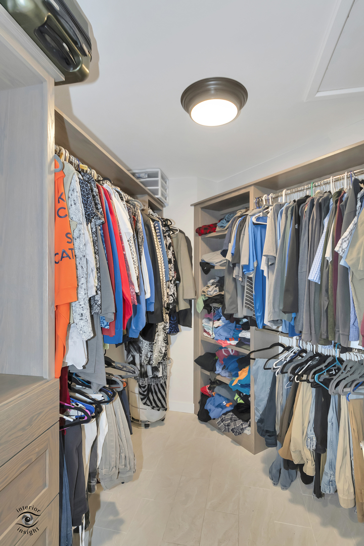 1560 Southhampton Drive Bourbonnais, IL 60914 - Photo 14 of 28 a view of walk in closet with clothes