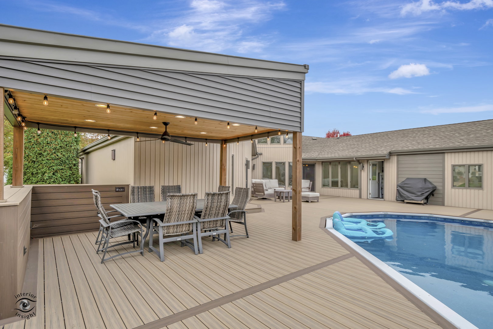 1560 Southhampton Drive Bourbonnais, IL 60914 - Photo 25 of 28 a view of a patio with dining table and chairs with wooden floor and fence