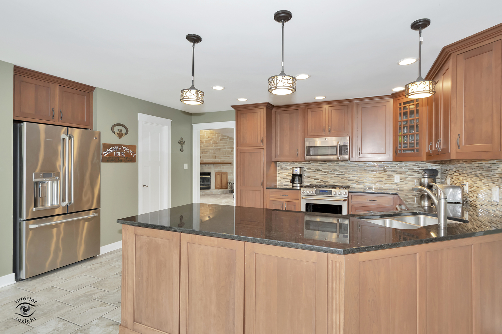 1560 Southhampton Drive Bourbonnais, IL 60914 - Photo 7 of 28 a kitchen with stainless steel appliances granite countertop a refrigerator a sink and a stove