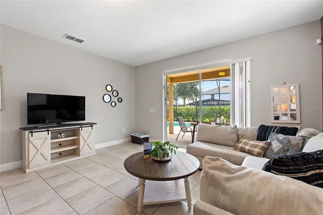 a living room with furniture and a table