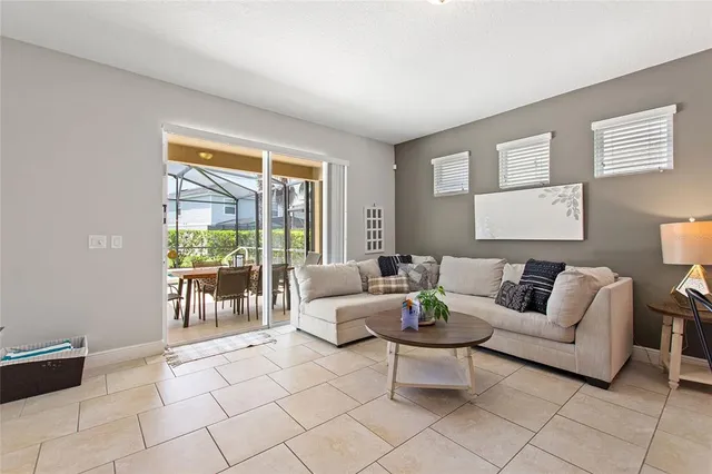 a living room kitchen with furniture and a view of kitchen