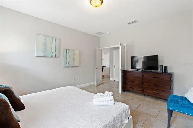 a bathroom with a tub a sink and a mirror