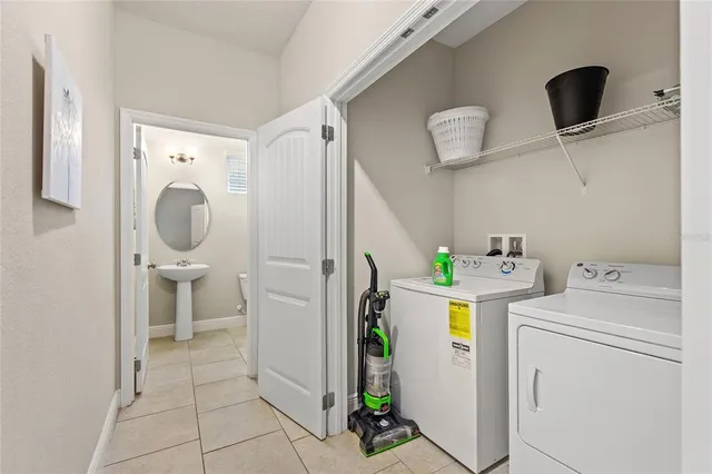 a bathroom with a sink toilet and a mirror