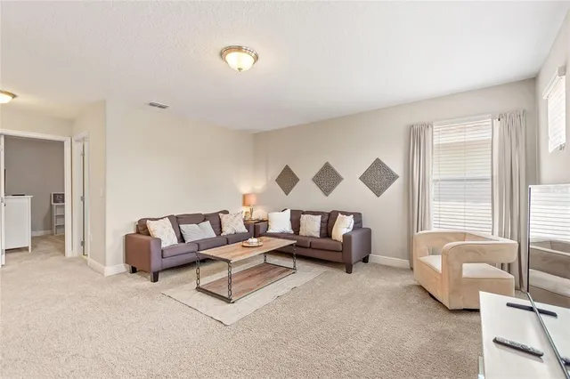 a living room with furniture and a couch