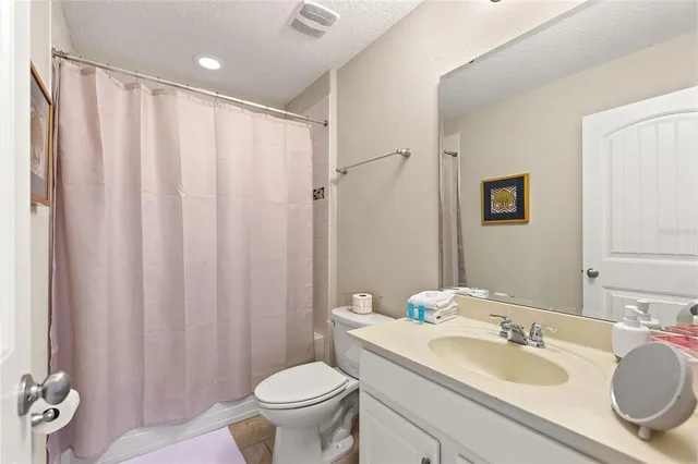 a bedroom with furniture and a baby crib