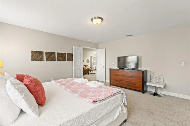 a bathroom with a tub sink and vanity