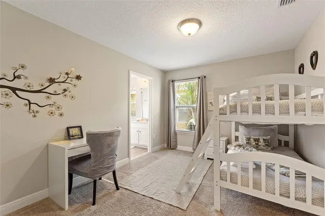 a bedroom with a bed and a chair