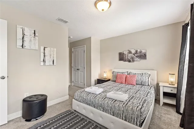 an aerial view of multiple houses with a yard