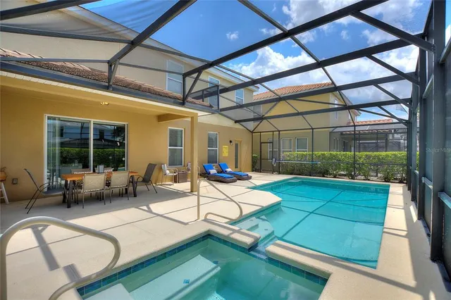 a view of swimming pool with a patio