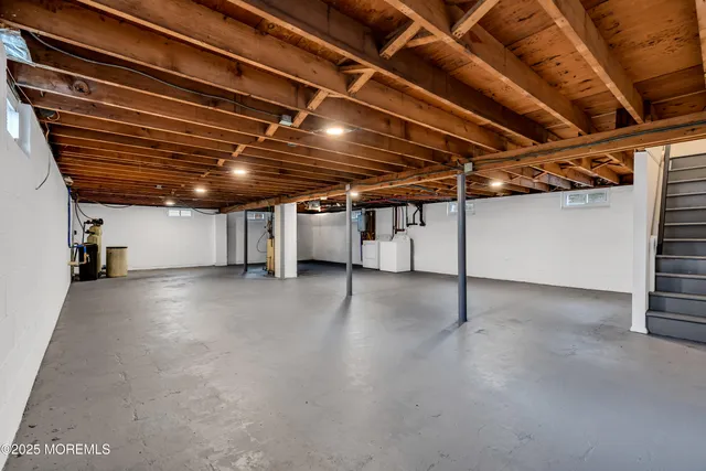 a view of empty room with wooden ceiling