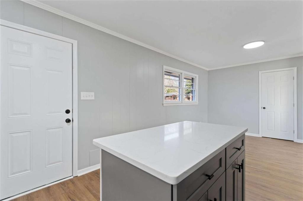 269 Elks Street Winder, GA 30680 - Photo 22 of 42 a white kitchen with a sink and a refrigerator