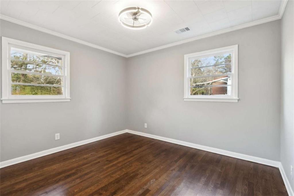 269 Elks Street Winder, GA 30680 - Photo 24 of 42 a view of room with wooden floor and window