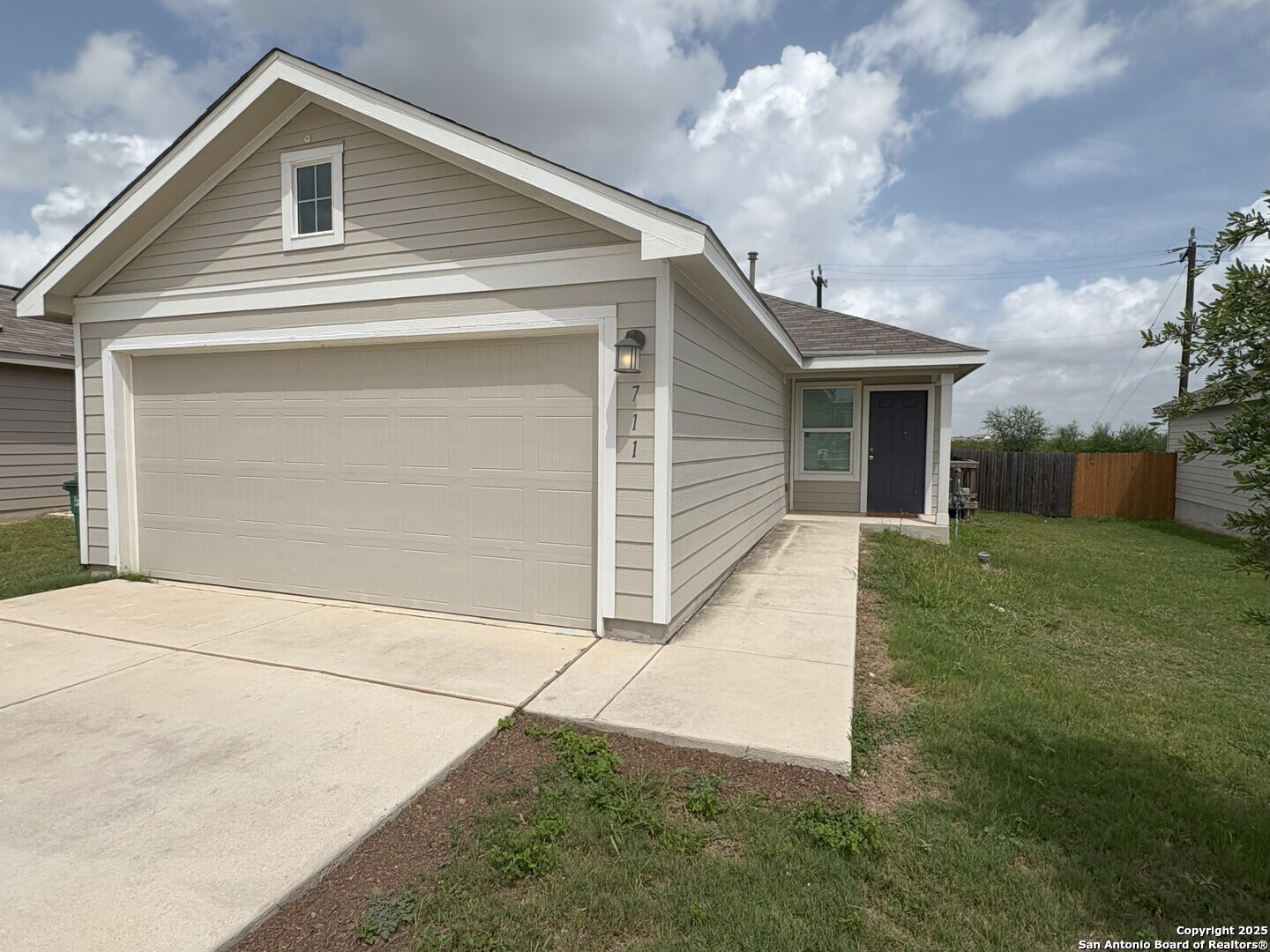 711 Vermilion San Antonio, TX 78221 - Photo 1 of 1 a front view of a house with garden