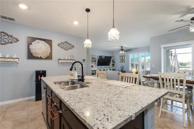 a kitchen with a table and chairs in it
