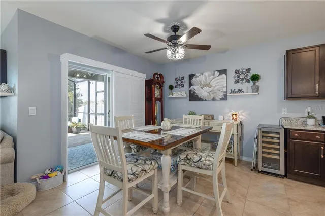 a view of a dining room with furniture and chandelier
