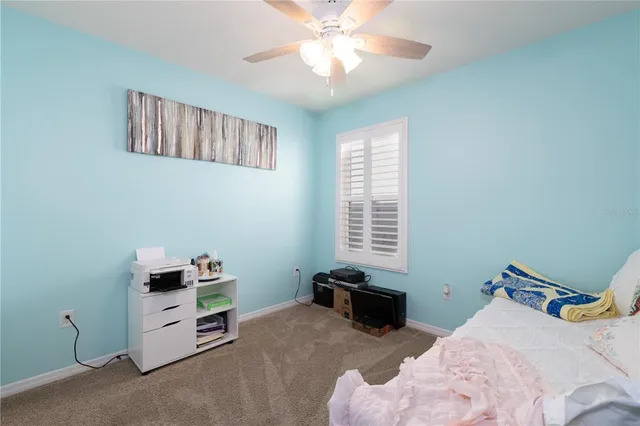 a bedroom with bed and a window