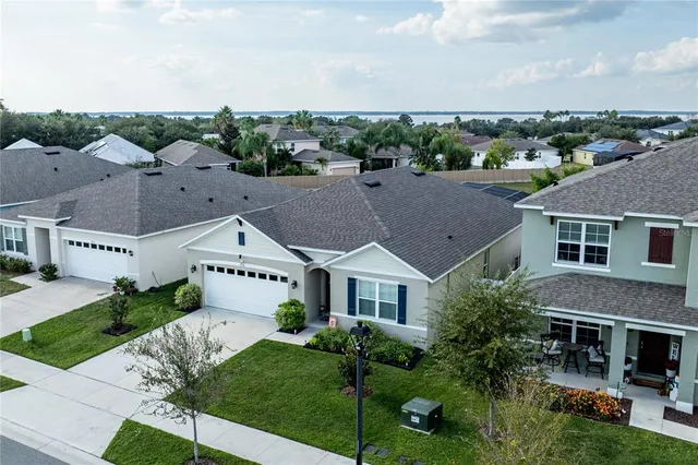 a aerial view of a house with a yard
