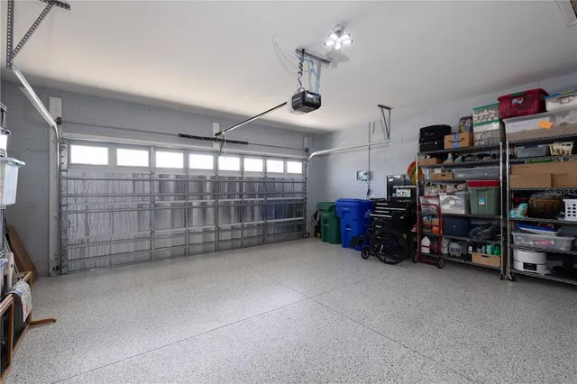 a room with lots of furniture and a chandelier