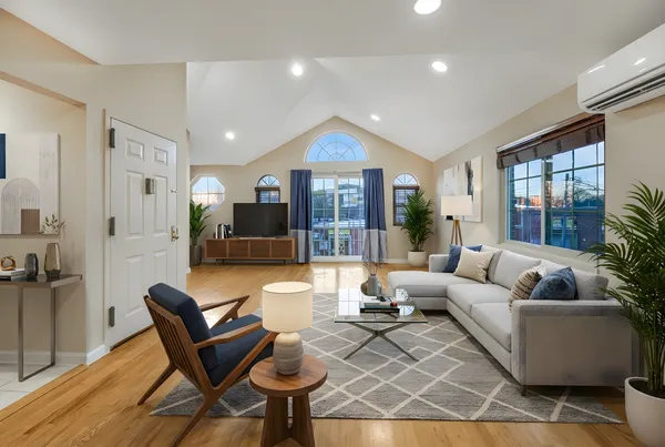 a living room with furniture and a large window