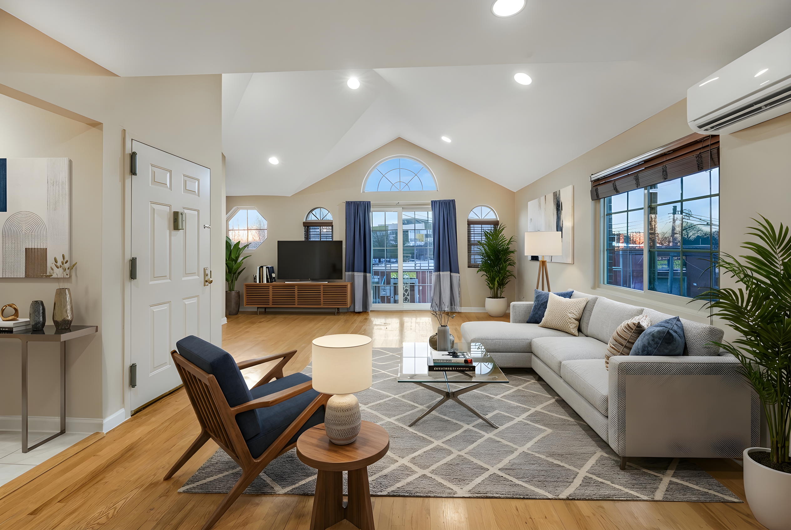 a living room with furniture and a large window