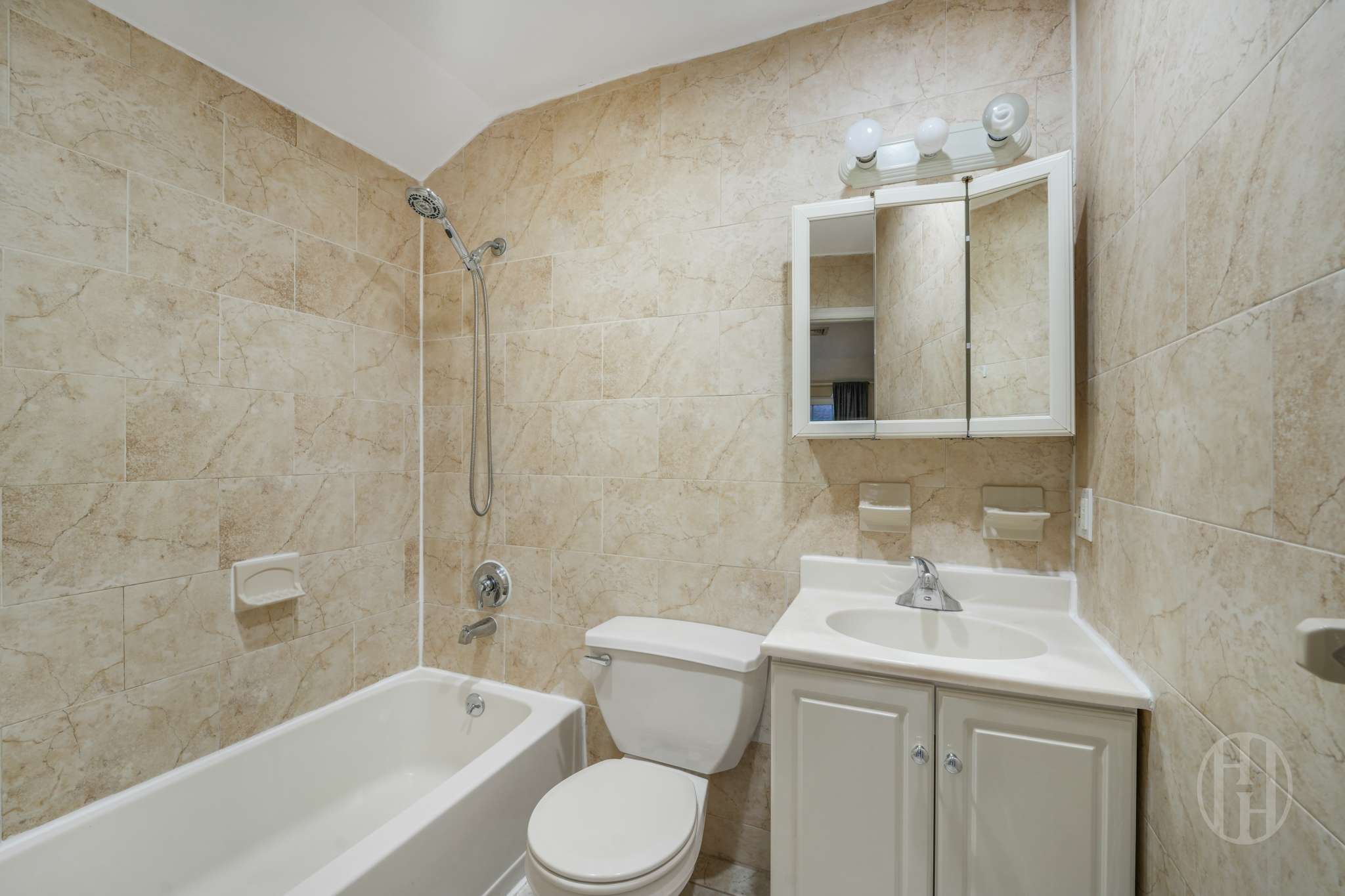 88-10 70th Road, Unit 2 Queens, NY 11375 - Photo 16 of 17 a bathroom with a sink toilet and shower