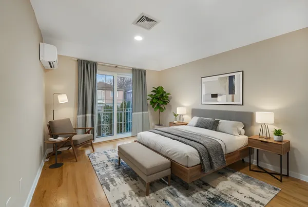 a bedroom with a large bed and a window